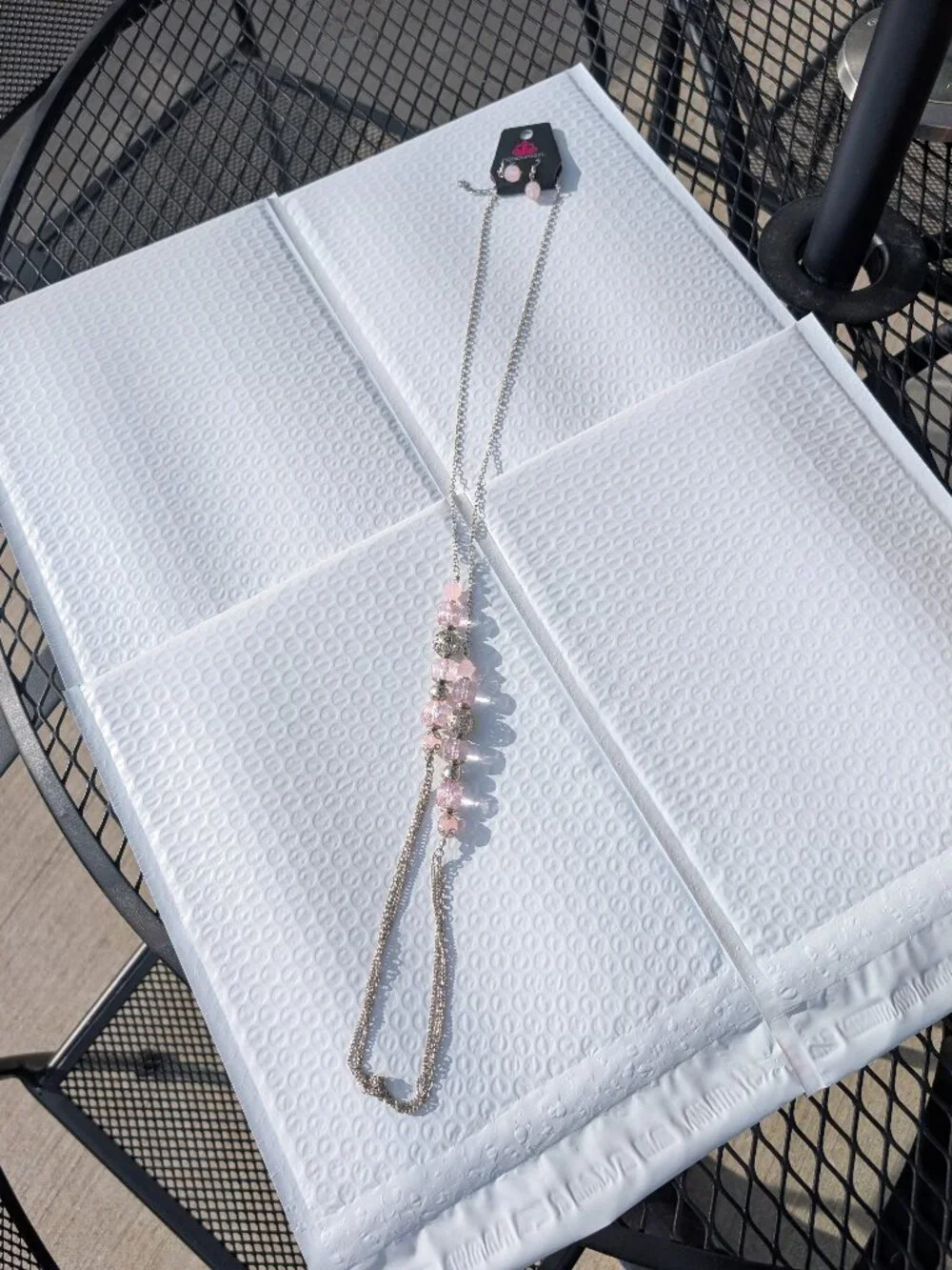 Light pink paparazzi necklace with matching earings set.